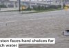 A roadside assistance vehicle is swamped by floodwaters on a Houston highway in 2024. Brandon Bell/Getty Images